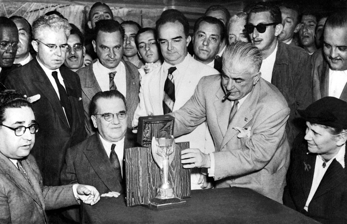 Representatives of the Italian football federation present the Jules Rimet Cup to their Brazilian counterparts 22 June 1950 in Rio de Janeiro, two days before the start of the 4th World Cup in Brazil. Photo: AFP