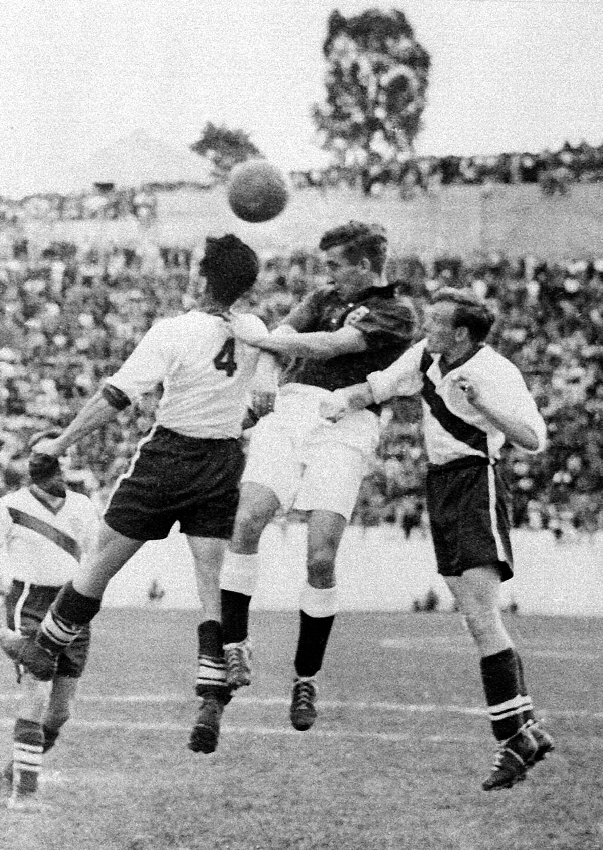 English midfielder Thomas Finney (C) tries to head the ball between American defenders Charlie Colombo and Walter Bahr 29 June 1950 in Belo Horizonte during the World Cup first-round match between England and the United States. Heavily-favored England was upset by the United States 1-0 on a goal scored by forward Joseph Gaetjens. Photo: AFP