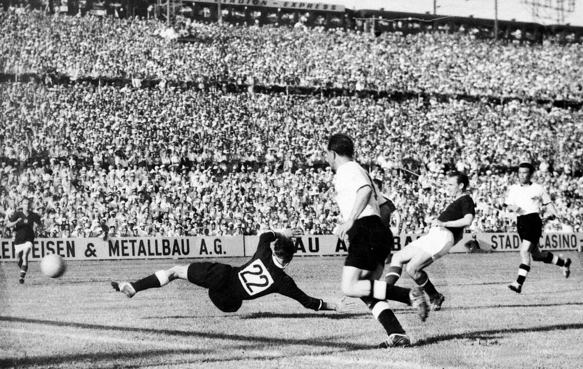 Hungarian forward Nandor Hidegkuti (2nd R) kicks the ball past German goalkeeper Heiner Kwiatkowski (22) to score a goal 20 June 1954 in Basel during the World Cup first-round match between Hungary and Germany. Photo: AFP