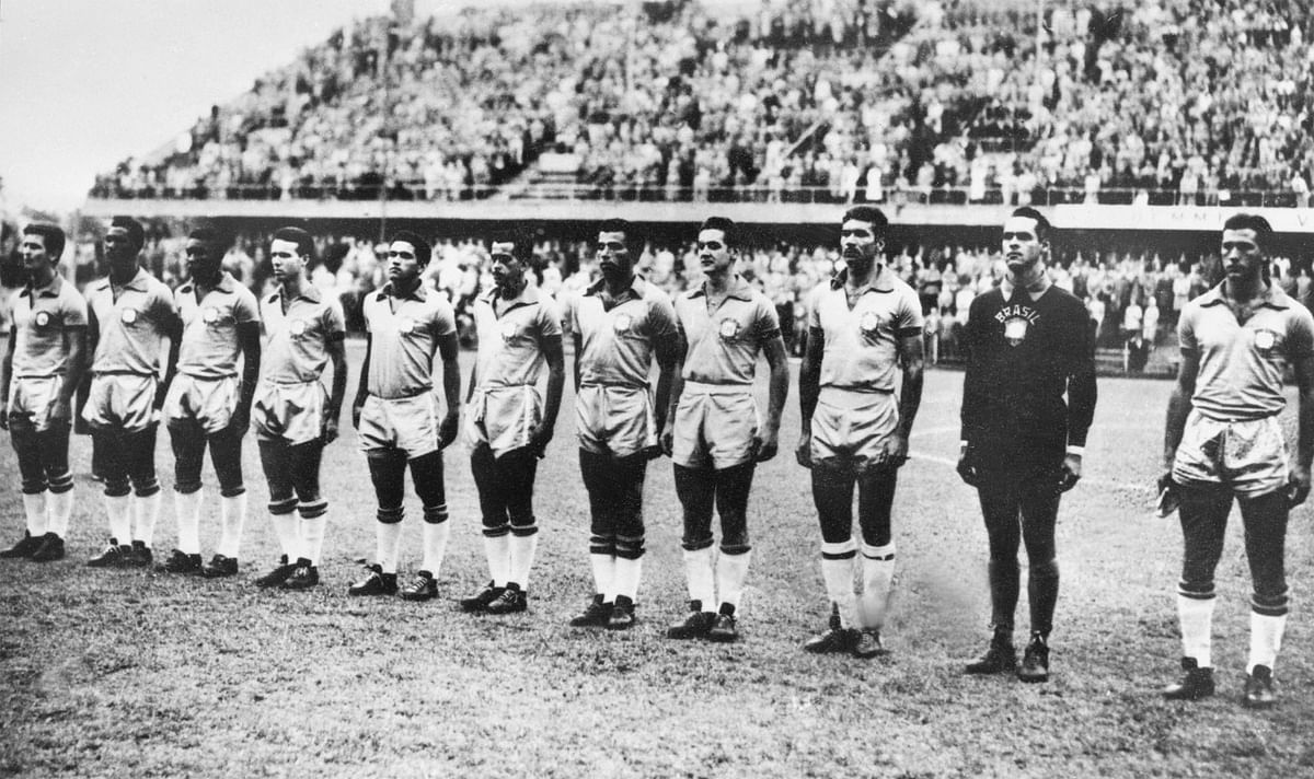 Brazilian national soccer team players are lined up during the national anthems before the start of their World Cup first round match against the Soviet Union on 14 June 1958 in Goteborg. Photo: AFP