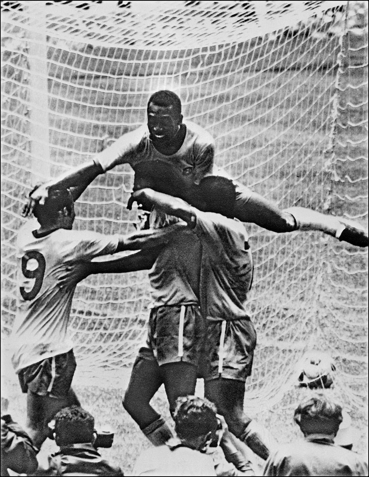 Brazilian forward Pele (top) celebrates with his teammates (from L) Tostao, Carlos Alberto and Jairzinho during the World Cup final against Italy on 21 June 1970 in Mexico City. Brazil won 4-1 to capture its third World title after winning in 1958 in Sweden and in 1962 in Chile. Photo: AFP