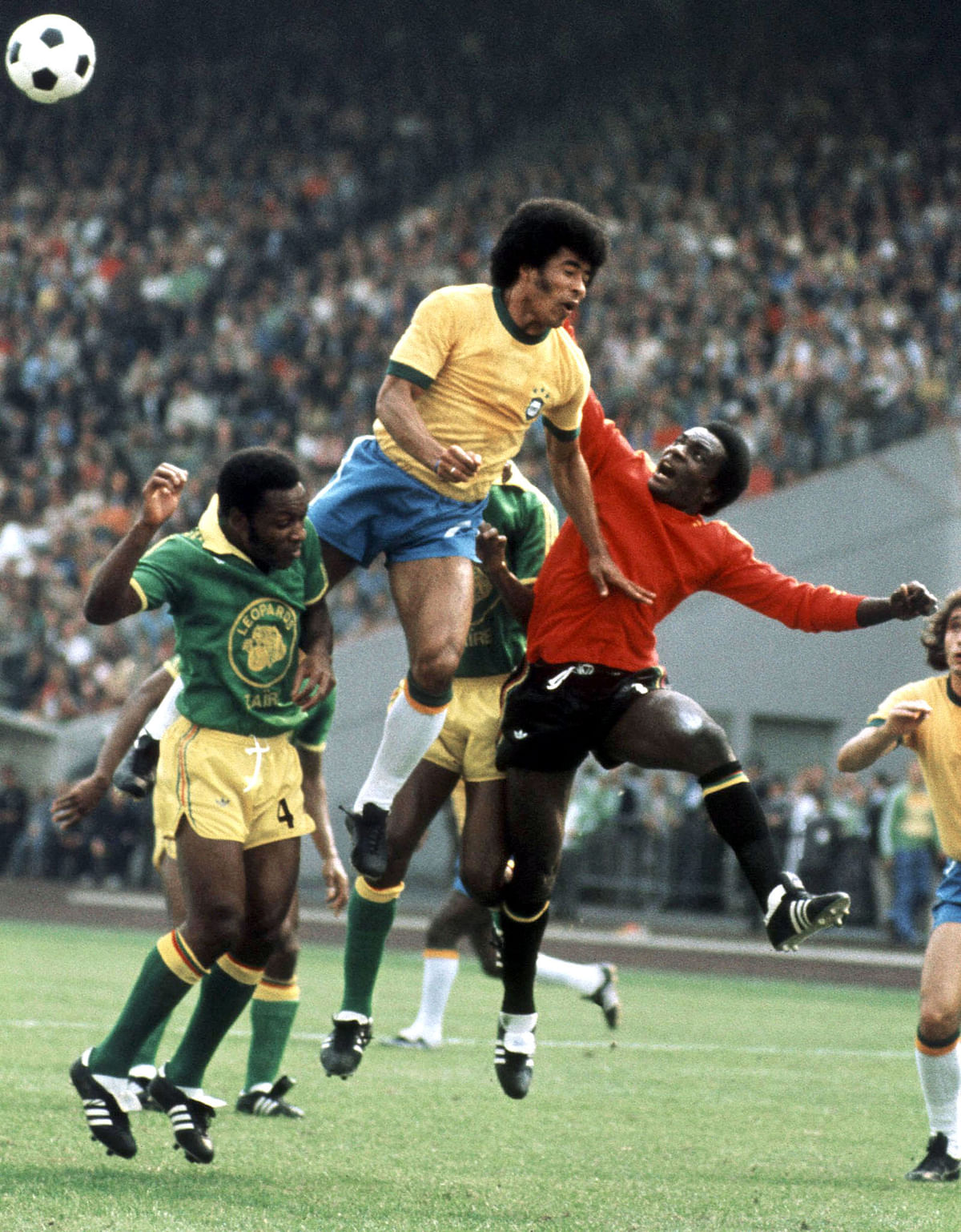 Goalkeeper Muamba Kazadi from Zaire punches the ball away from Brazilian forward Jairzinho during the World Cup first round soccer match between Brazil and Zaire on 22 June 1974 in Gelsenkirchen. Jairzinho scored the first goal for his team as Brazil beat Zaire 3-0. (At left is defender Tshimen Buhanga). Photo: AFP