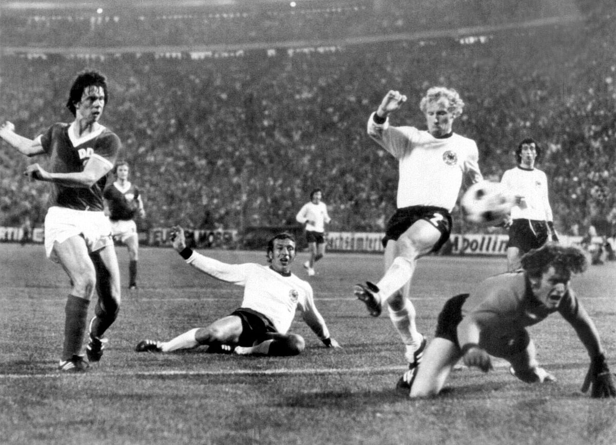 East German forward Juergen Sparwasser (L) scores the winning goal past West German defenders Horst Hoettges (C), Berti Vogts (2) and goalkeeper Sepp Maier on 22 June 1974 in Hamburg during the World Cup first round soccer match between the two countries. East Germany beat West Germany 1-0. Photo: AFP