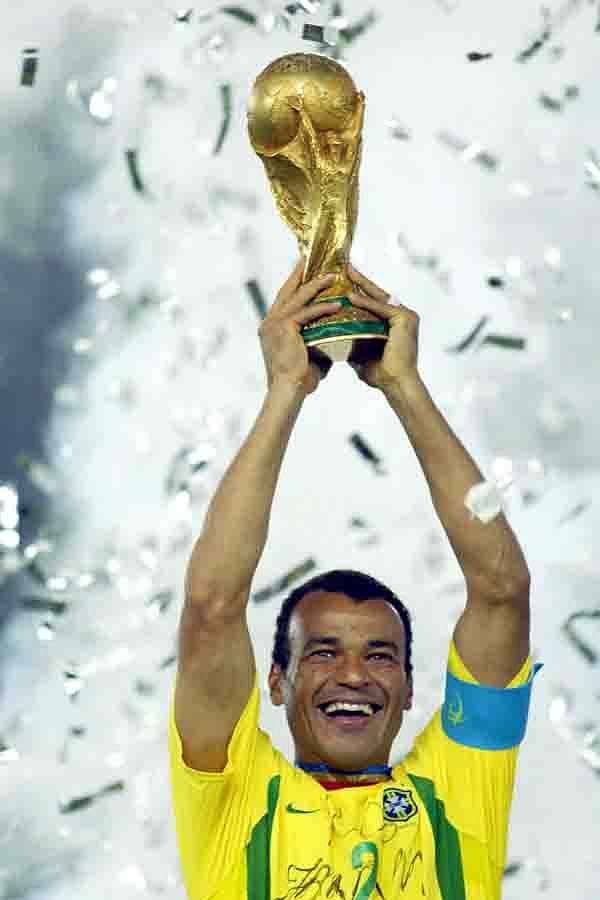 Brazil's team captain and defender Cafu hoists the World Cup trophy after Brazil won 2-0 against Germany in match 64 of the 2002 FIFA World Cup Korea Japan final on 30 June 2002 at the International Stadium Yokohama in Japan. Brazil has now won a record five World Cup titles.Brazil previously was a FIFA World Cup winner in 1958, 1962, 1970 and 1994. Photo: AFP