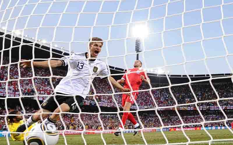 Germany's midfielder Thomas Mueller (C) celebrates as he scores Germany's third goal past England's defender Matthew Upson (R) and England's goalkeeper David James (L) during the 2010 World Cup round of 16 football match Germany vs. England on June 27, 2010 at Free State stadium in Mangaung/Bloemfontein. Germany defeated England 4-1. Photo: AFP