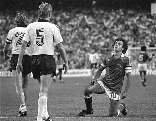 French captain and midfielder Michel Platini gets up slowly after being tackled during the World Cup semifinal match between France and West Germany on 08 July 1982 in Seville. West. Germany beat France in the penalty shootout at the end of extra time after both teams were tied at 3 (1-1 at the end of regulation time). Photo: AFP