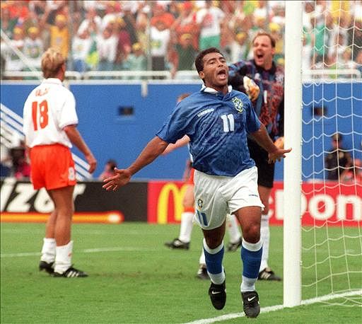 Brazilian forward Romario celebrates after scoring a goal as Dutch goalkeeper Ed De Goej (R) reacts 09 July 1994 in Dallas during their World Cup quarterfinal soccer match. Brazil won 3-2 to advance to the semifinals. (At left is Dutch Stan Valckx). Photo: AFP