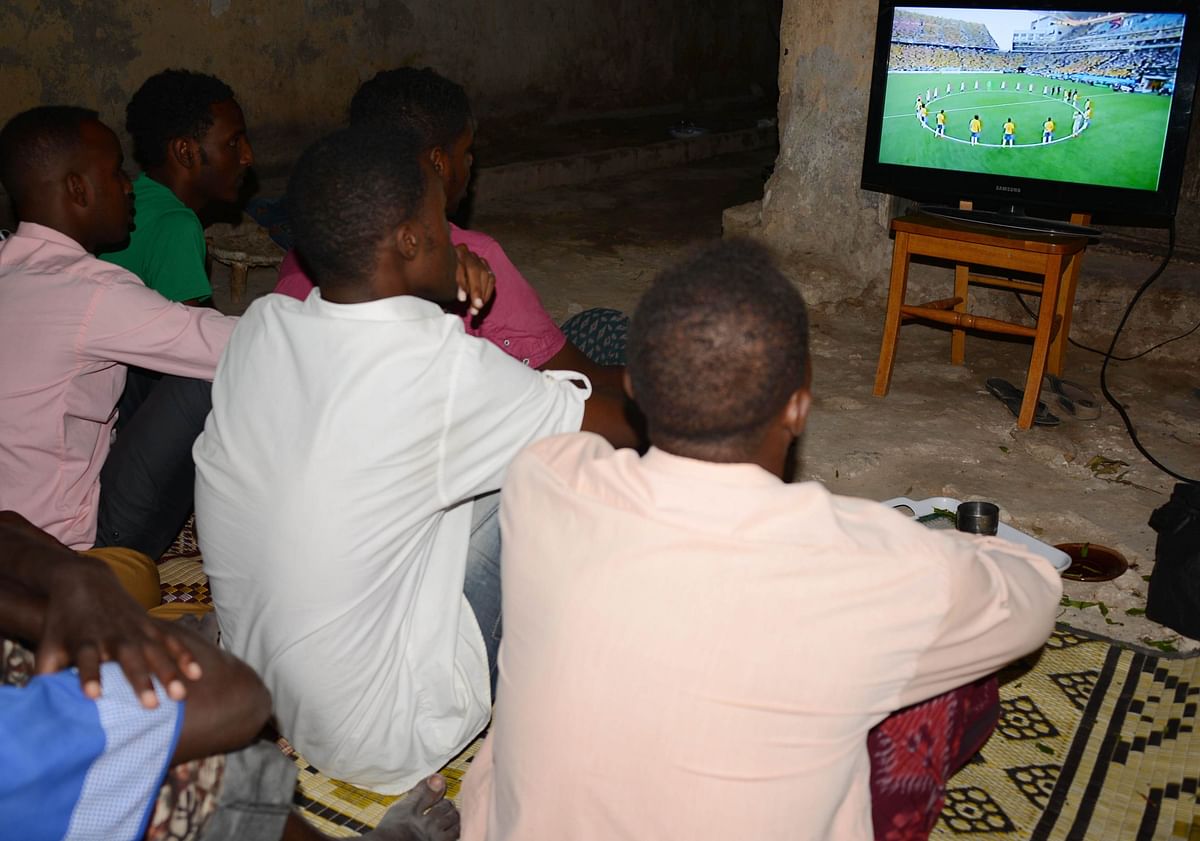 Fans watch a live screening of the opening match Brazil vs Croatia of the 2014 World cup in Brazil June 12, 2014 in the Somalian capital Mogadishu. Photo: AFP