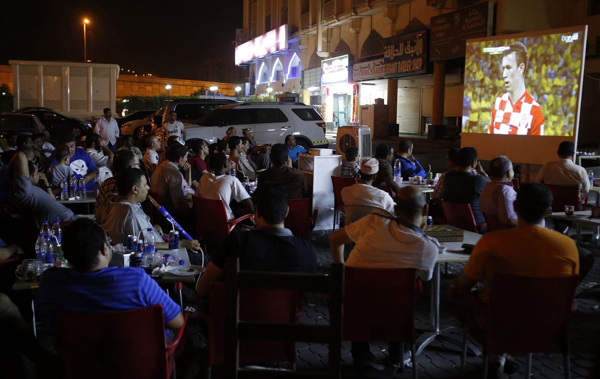 Omani football fans watch a live screening of the opening World Cup 2014 match between Brazil and Croatia on June 12, 2014 in the Omani capital Muscat. Photo: AFP