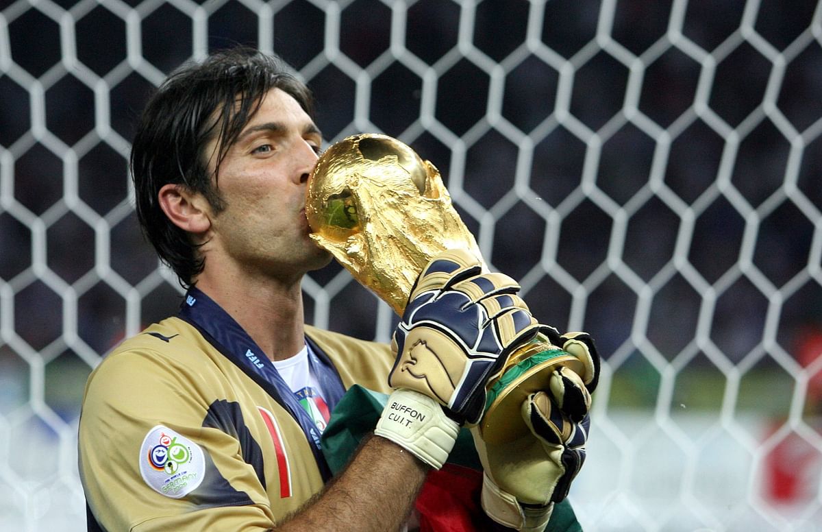 Italian goalkeeper Gianluigi Buffon kisses the trophy after the World Cup 2006 final football game Italy vs.France on 09 July 2006 at Berlin stadium. Italy won the 2006 football World Cup by defeating France on penalties. AFP