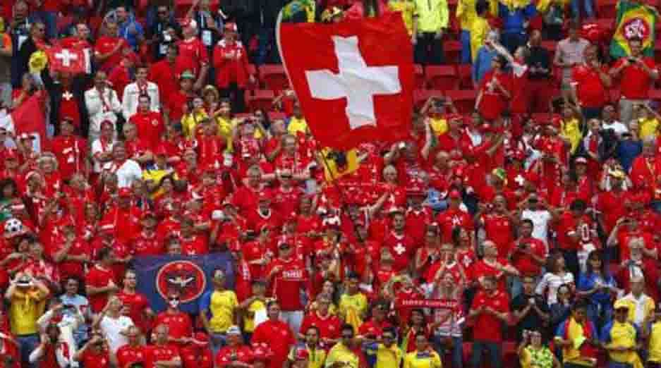 Fans of Switzerland cheer during the 2014 World Cup Group E soccer match against Ecuador at the Brasilia national stadium in Brasilia, June 15, 2014. Reuters