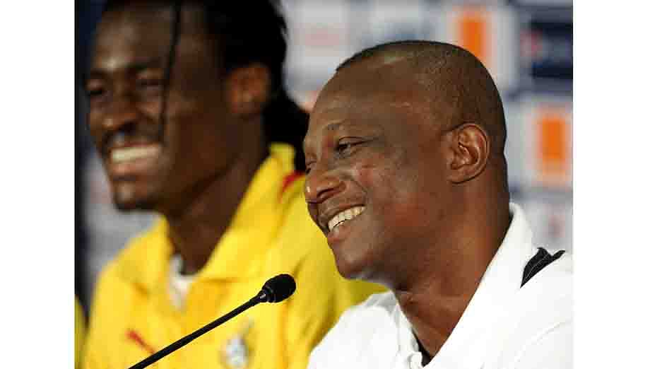 Ghana's national football team head coach Kwesi Appiah (R), flanked by midfielder Derek Boateng, give a press conference at Nelson Mandela Bay Stadium in Port Elizabeth on January 26, 2013, two days before a 2013 African Cup of Nation Group B football match against Niger. AFP