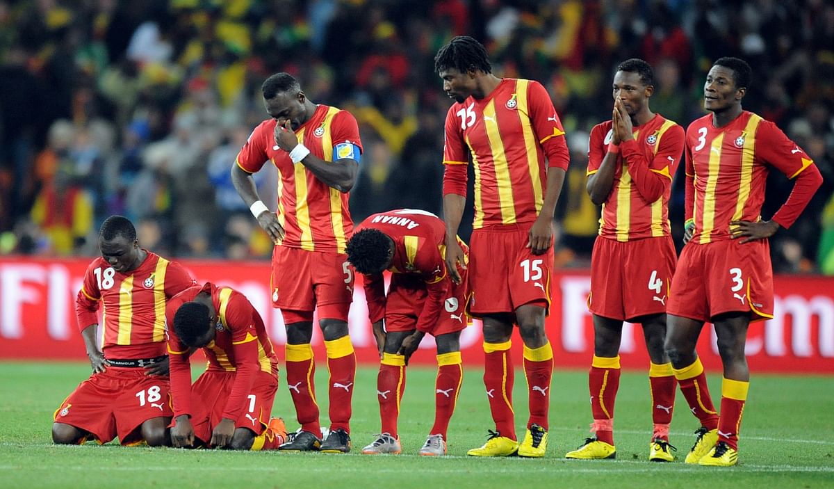 Members of Ghana react before losing in a penalty shootout after extra time in the 2010 World Cup quarter-final football match between Uruguay and Ghana on July 2, 2010 at Soccer City stadium in Soweto, in suburban Johannesburg. AFP