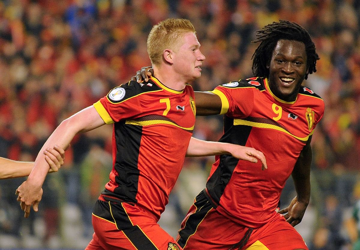 Belgium's midfielder Kevin De Bruyne (L) celebrates with forward Romelu Lukaku after scoring during the 2014 World Cup Group G qualifying football match between Belgium and Wales at King Baudouin stadium in Brussels on October 15, 2013. AFP