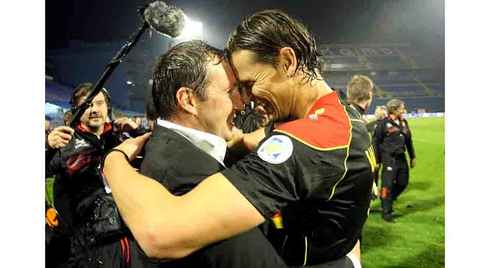 Belgium's coach Marc Wilmots (front L) and defender Daniel Van Buyten celebrate their team's victory over Croatia at the end of the World Cup 2014 qualifying football match Croatia vs Belgium at Maksimir stadium in Zagreb, on October 11, 2013. Belgium won 2-1 to qualify for the World Cup finals. AFP