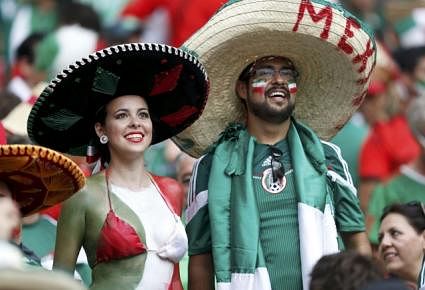 Fans of Mexico wait for the start of their 2014 World Cup Group A soccer match against Brazil at the Castelao arena in Fortaleza on June 17, 2014. Reuters