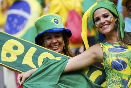 Fans of Brazil pose for a photo before their 2014 World Cup Group A soccer match against Mexico at the Castelao arena in Fortaleza on June 17, 2014. Reuters