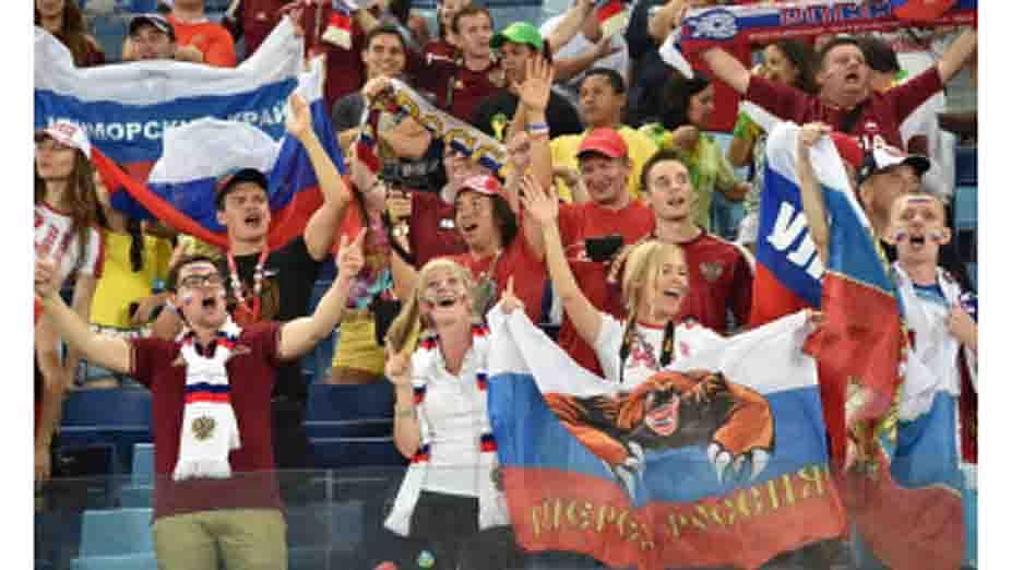 Russia fans cheer their team during the 2014 FIFA World Cup Group H football match between Russia and South Korea in the Pantanal Arena in Cuiaba on June 17, 2014. AFP