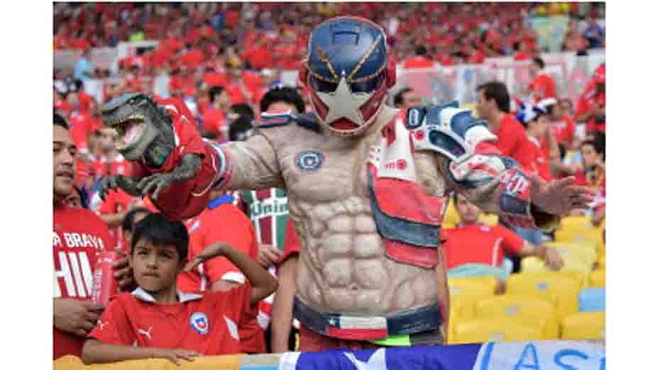A Chilean supporter holds a plastic toy aloft ahead of the Group B football match between Spain and Chile in the Maracana Stadium in Rio de Janeiro on June 18, 2014, during the 2014 FIFA World Cup. AFP