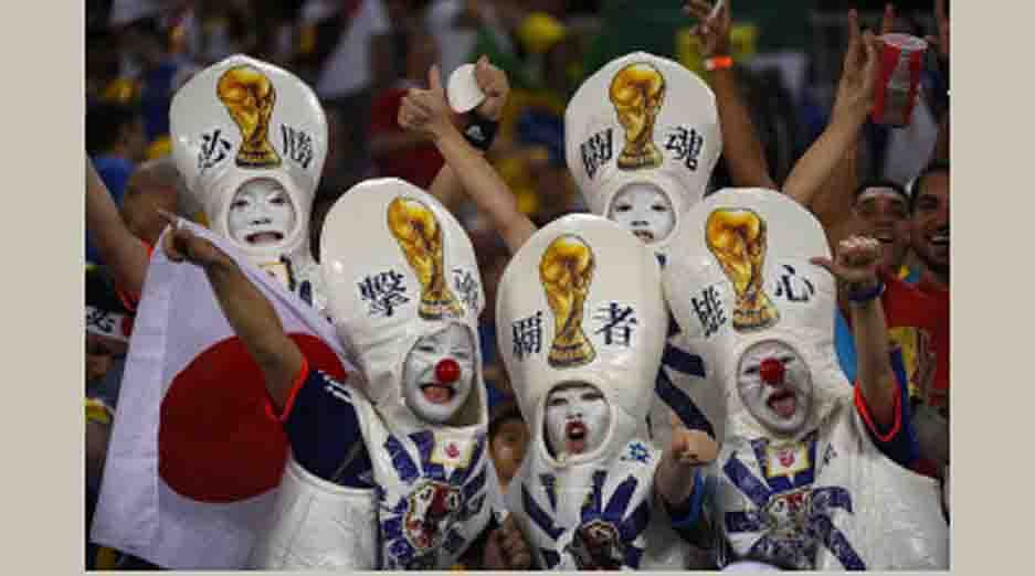 Japanese fans cheer during a Group C football match between Japan and Greece at the Dunas Arena in Natal during the 2014 FIFA World Cup on June 19, 2014. AFP