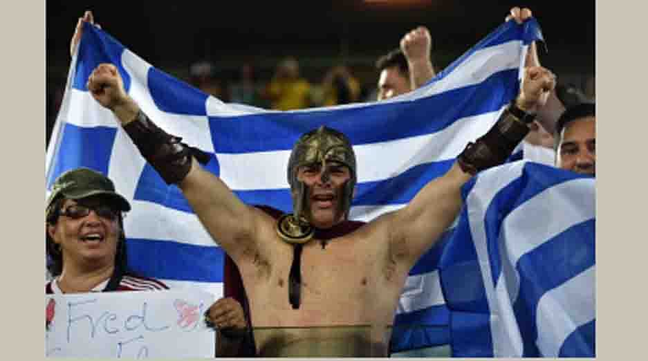Greece fans cheer before the start of a Group C match between Japan and Greece at the Dunas Arena in Natal during the 2014 FIFA World Cup on June 19, 2014. AFP