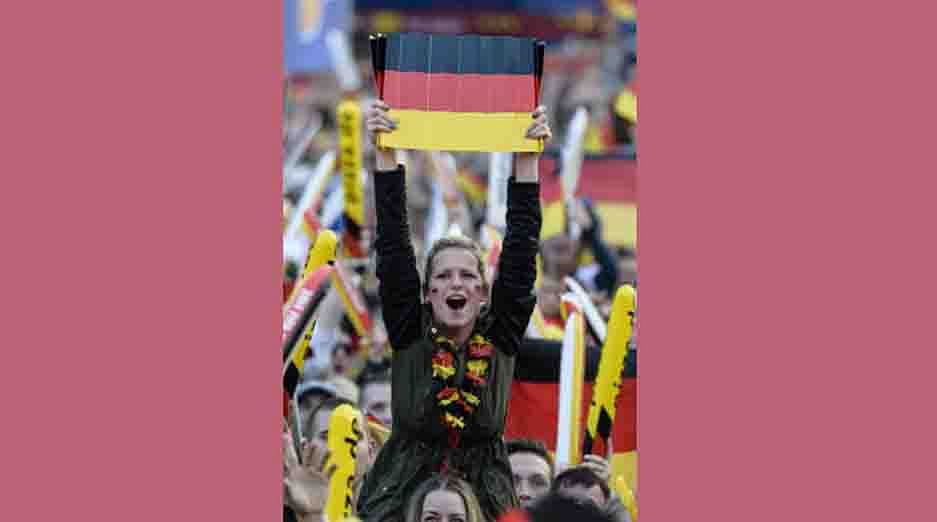 Fans wave the German flag during the public viewing near the Brandenburg Gate in Berlin, Germany on June 21, 2014 of the FIFA World Cup 2014 group G football match Germany vs Ghana played in Fortaleza, Brazil. AFP