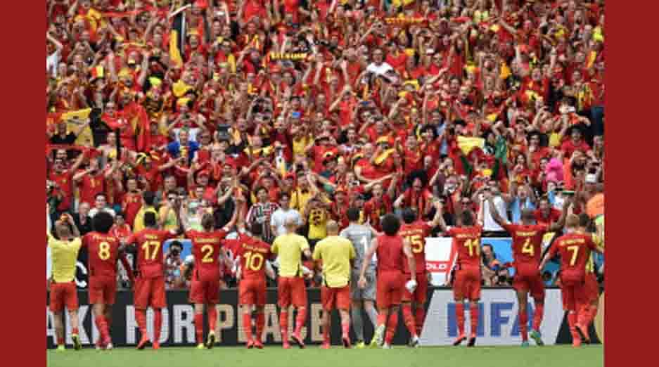 Belgian players greet supporters as they celebrate after their victory in the Group H football match between Belgium and Russia at The Maracana Stadium in Rio de Janeiro on June 22, 2014, during the 2014 FIFA World Cup. AFP
