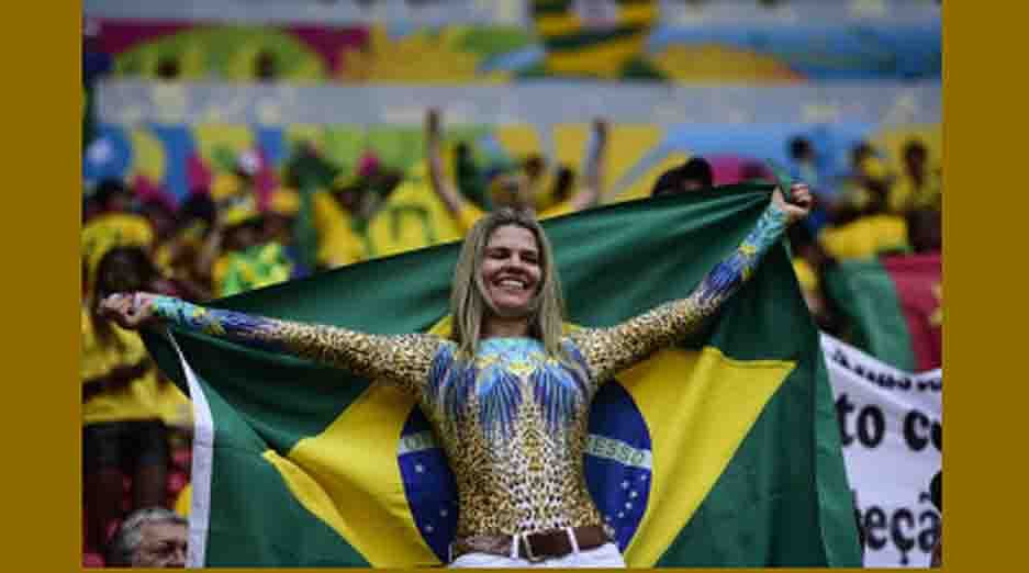A Brazilian supporter cheers prior to a Group A football match between Cameroon and Brazil at the Mane Garrincha National Stadium in Brasilia during the 2014 FIFA World Cup on June 23, 2014. AFP