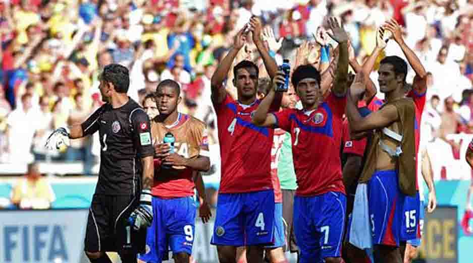 The Costa Rica team celebrate after a 0-0 draw during a Group D match between Costa Rica and England at the Mineirao Stadium in Belo Horizonte during the 2014 FIFA World Cup on June 24, 2014. AFP