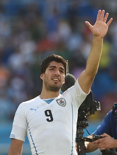 Uruguay's forward Luis Suarez celebrates their victory at the end of a Group D football match between Italy and Uruguay at the Dunas Arena in Natal during the 2014 FIFA World Cup on June 24, 2014. Uruguay won 1-0. AFP