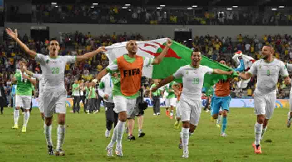 Algerian players celebrate at the end of their Group H football match against Russia at the Baixada Arena in Curitiba during the 2014 FIFA World Cup on June 26, 2014. AFP