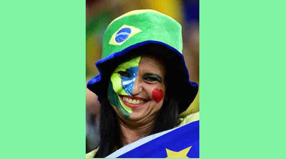 A Brazilian fan smiles during the round of 16 football match between Costa Rica and Greece at Pernambuco Arena in Recife during the 2014 FIFA World Cup on June 29, 2014. AFP