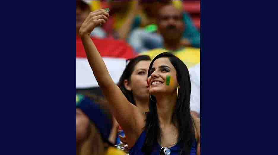 A fan takes a selfie before the 2014 World Cup round of 16 game between France and Nigeria at the Brasilia national stadium in Brasilia on June 30, 2014. Reuters