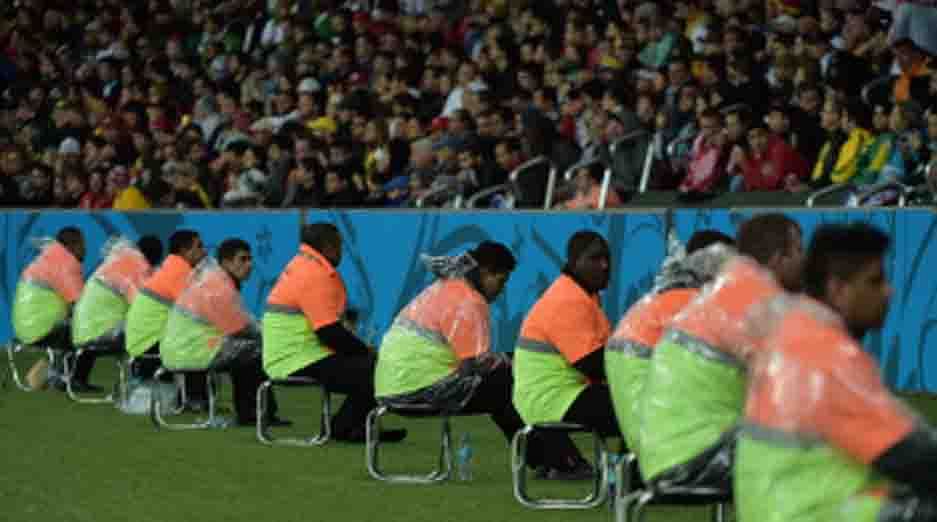 Security sit on guard during a Round of 16 football match between Germany and Algeria at Beira-Rio Stadium in Porto Alegre during the 2014 FIFA World Cup on June 30, 2014. AFP