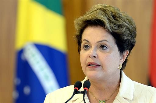 Brazilian President Dilma Rousseff delivers a speech during a signing-of-agreements ceremony with Angola's President Jose Eduardo Santos, at Planalto Palace in Brasilia, on June 16, 2014. AFP