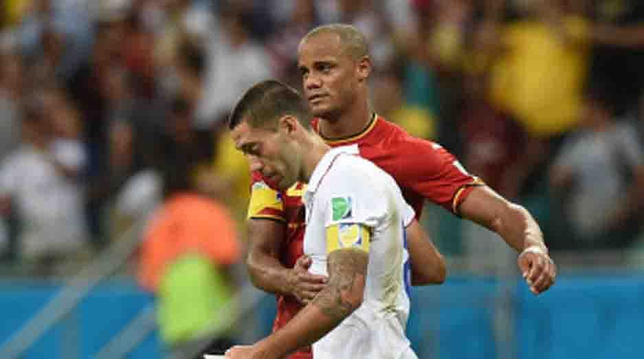 US forward and captain Clint Dempsey (front) is comforted by Belgium
