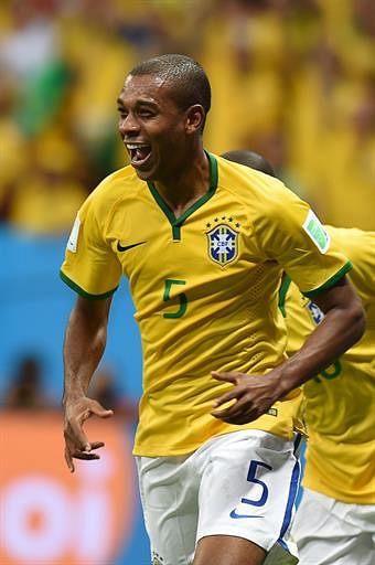 Brazil's midfielder Fernandinho celebrates after scoring their fourth goal during the Group A football match between Cameroon and Brazil at the Mane Garrincha National Stadium in Brasilia during the 2014 FIFA World Cup on June 23, 2014. AFP