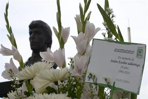 Flowers on the monument to late Colombian footballer Andres Escobar during a ceremony in his honour in Medellin, Antioquia department, Colombia on July 2, 2014. AFP