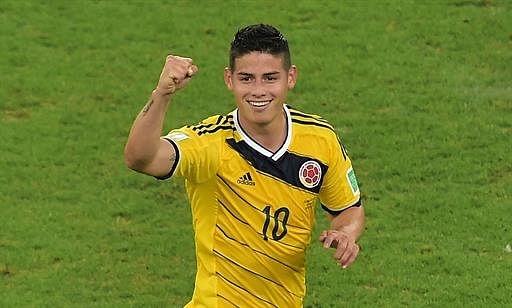 Colombia's midfielder James Rodriguez celebrates scoring the 2-0 goal during the Round of 16 football match between Colombia and Uruguay at the Maracana Stadium in Rio de Janeiro during the 2014 FIFA World Cup in Brazil on June 28, 2014. AFP