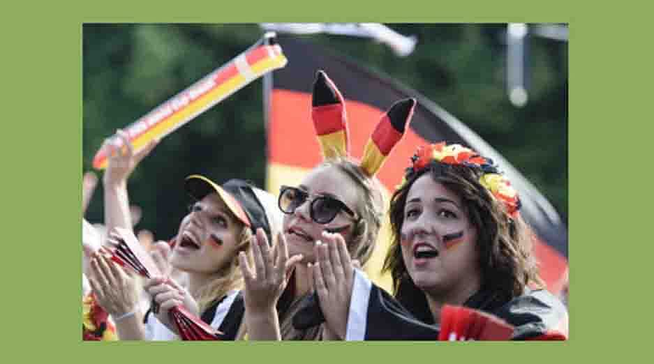 German football fans cheer as they watch on a giant screen the FIFA World Cup 2014 quarter-final football match between Germany and France, Germany on July 4, 2014 in Berlin. AFP