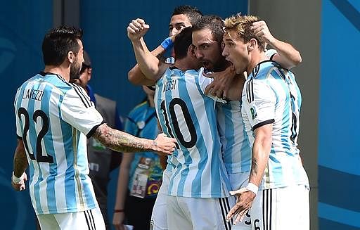 Argentina's players celebrate a goal during a quarter-final football match between Argentina and Belgium at the Mane Garrincha National Stadium in Brasilia during the 2014 FIFA World Cup on July 5, 2014. AFP