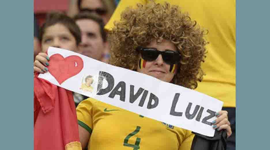 A fan holds a sign for Brazil