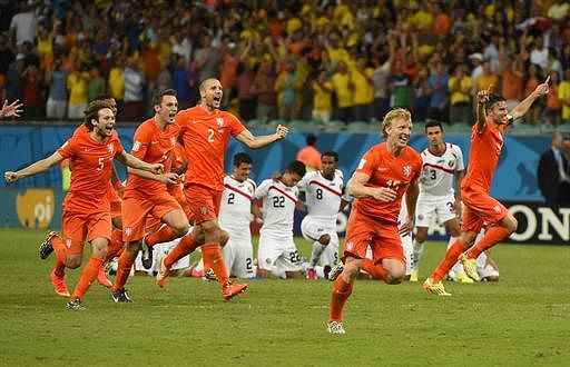 Netherlands' footballers celebrate after defeating Costa Rica during the penalty shootout after the extra time in the quarter-final football match between Netherlands and Costa Rica at the Fonte Nova Arena in Salvador during the 2014 FIFA World Cup on July 5, 2014. AFP