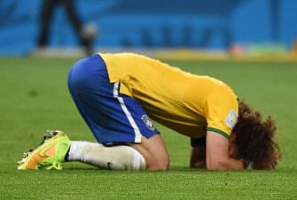 Brazil's defender David Luiz reacts after defeat in the semi-final football match between Brazil and Germany at The Mineirao Stadium in Belo Horizonte on July 8, 2014, during the 2014 FIFA World Cup. AFP