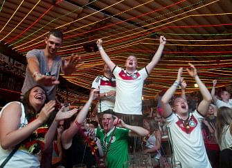 Germany fans celebrate a goal during the 2014 FIFA World Cup semi final football match between Brasil and Germany in Palma de Mallorca on July 8, 2014. AFP