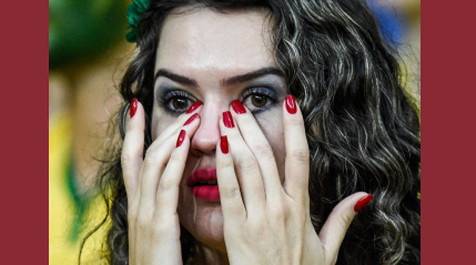 A fan of Brazil gestures during the Brazil 2014 FIFA World Cup semifinal match Brazil vs Germany, outside the Mineirao Stadium in Belo Horizonte, on July 8, 2014. AFP