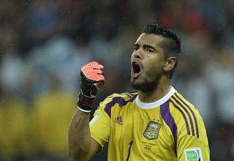 Argentina's goalkeeper Sergio Romero reacts after saving a penalty during penalty shoot-outs following extra time during the semi-final football match between Netherlands and Argentina of the FIFA World Cup at The Corinthians Arena in Sao Paulo on July 9, 2014. AFP