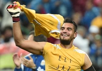 Argentina's goalkeeper Sergio Romero celebrates after the semi-final football match between Netherlands and Argentina of the FIFA World Cup at The Corinthians Arena in Sao Paulo on July 9, 2014. AFP