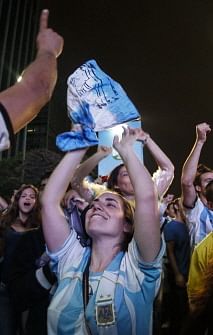 Argentine fans celebrate on the streets after beating the Netherlands in the FIFA World Cup Brazil 2014 semi-final football match in Sao Paulo, Brazil on July 9, 2014. Argentina beat the Netherlands 4-2 in penalty kicks and will face Germany in the FIFA World Cup final on July 13. AFP