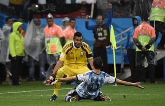 Argentina's midfielder Maxi Rodriguez (front) and Argentina's goalkeeper Sergio Romero celebrate after winning their FIFA World Cup semi-final match against the Netherlands in a penalty shoot-out following extra time at The Corinthians Arena in Sao Paulo on July 9, 2014. AFP
